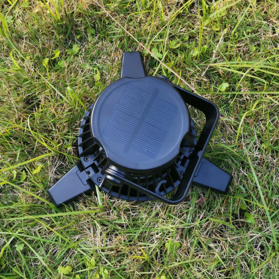 Rechargeable solar-powered camping fan with LED light, featuring a foldable design, hanging hook, and multiple airflow settings for outdoor use