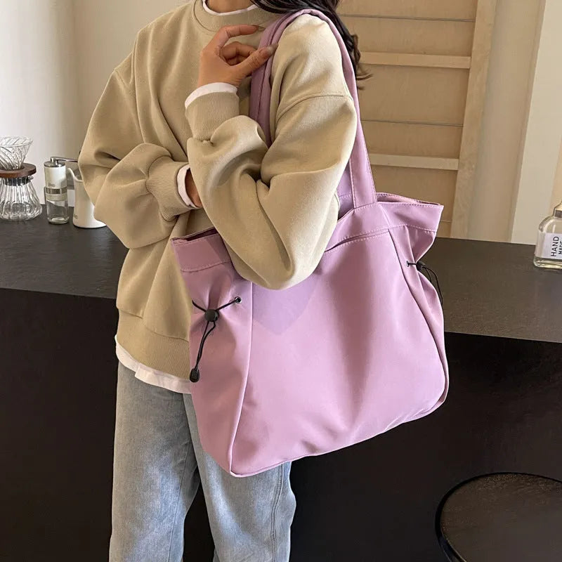 Soft Oxford cloth foldable commuter tote bag in street style, shown in multiple colour options.