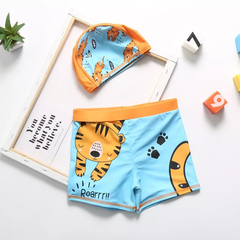 Cartoon dinosaur swimming trunks for boys in light blue, dark blue, and orange