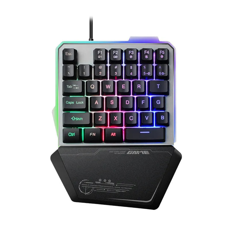 Black one-handed keyboard with RGB backlight and 1.8-metre USB cable on a desk