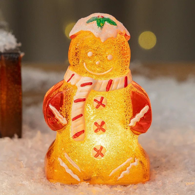 Glowing gingerbread man Christmas ornament measuring 6.5cm wide with LED lights and red scarf