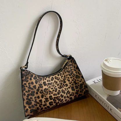 Women's leopard print underarm bag with zipper closure and internal phone pocket