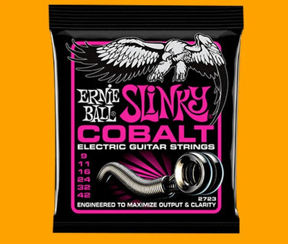 Coils of nickel-plated electric guitar strings and bass strings showing their metallic shine.