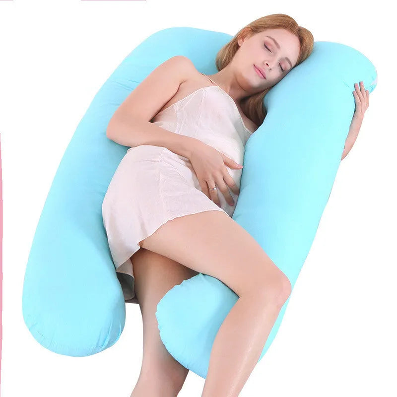Large U-shaped pregnancy support pillow with removable cover and abdominal support belt.