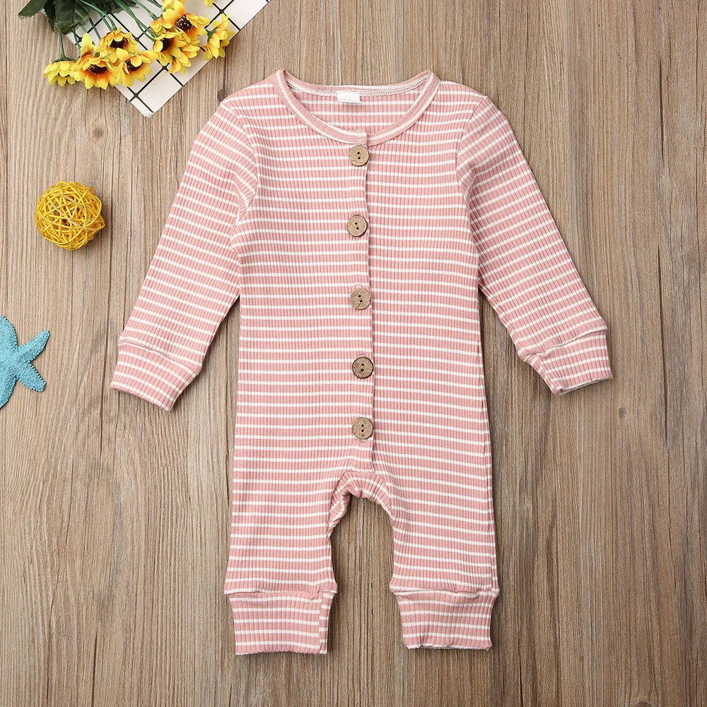 Newborn wearing a striped knitted jumpsuit in cotton, sizes 70-100cm, available in six colours