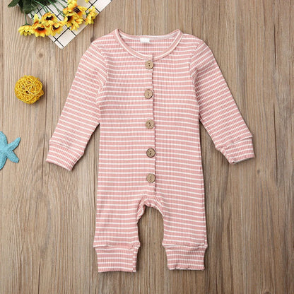 Newborn wearing a striped knitted jumpsuit in cotton, sizes 70-100cm, available in six colours