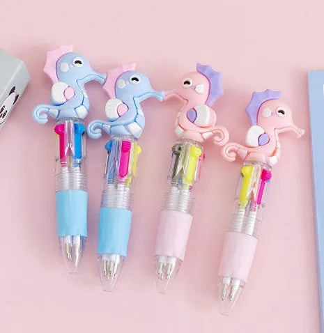 Cartoon-themed four-colour press ballpoint pen with 0.7mm tip showing random design selection
