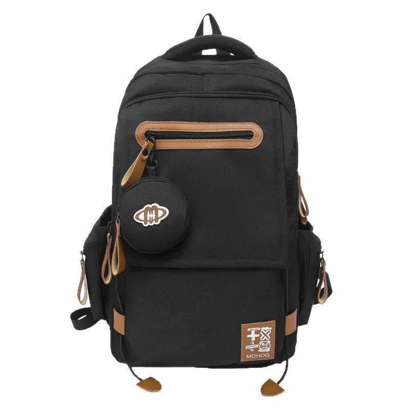 Large waterproof nylon travel backpack in blue with contrast stitching and 20-35 litre capacity