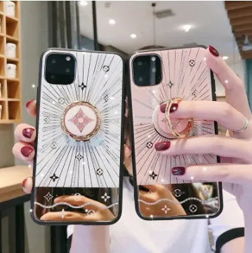 Gold-plated iPhone ring stand holder adorned with luxury diamond crystals, shown in rose gold and white gold colours.
