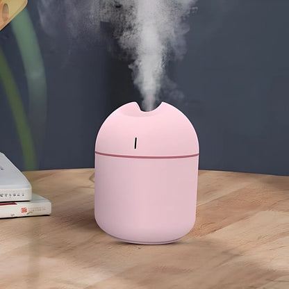 White aromatherapy humidifier with 1-litre tank and USB cable for room moisture control