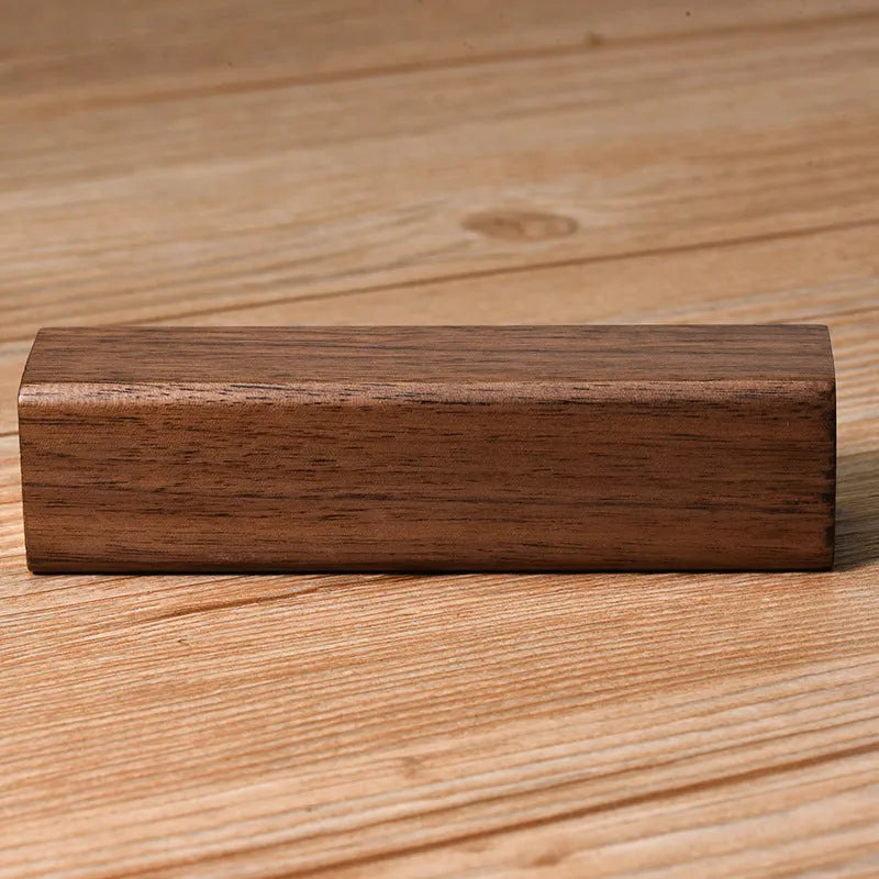 Brown walnut wood portable power bank with 2000mAh capacity showing compact rectangular design