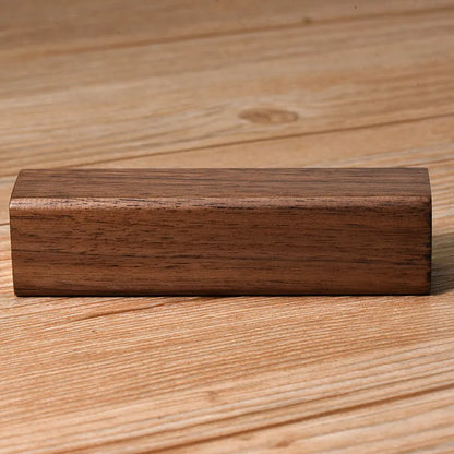 Brown walnut wood portable power bank with 2000mAh capacity showing compact rectangular design