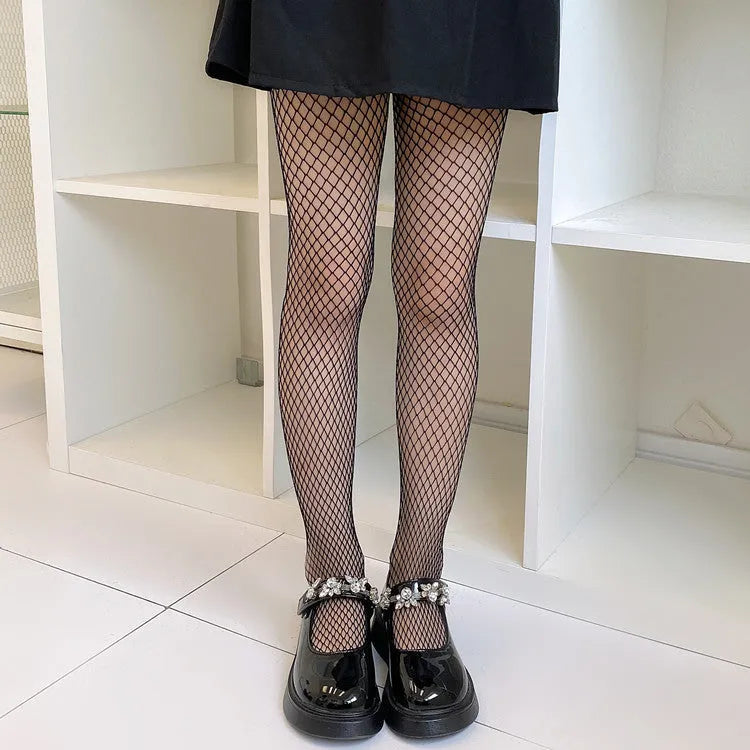 Women's black and white mesh stockings showing large, medium, and small hole patterns.