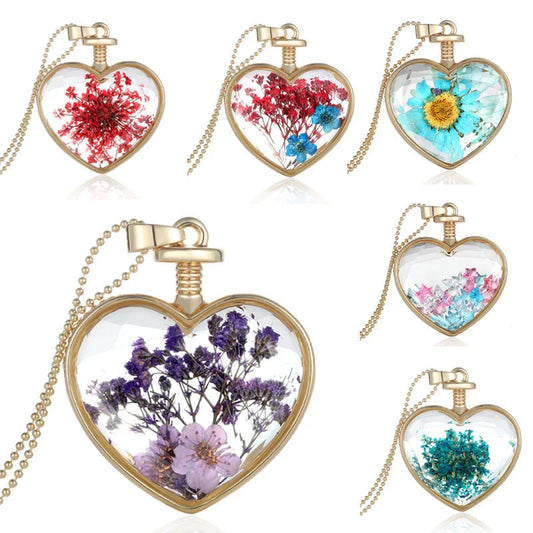 Elegant round pendant necklace with dried flower specimen in various colors including yellow, blue, purple, red, and orange