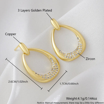 Women's yellow gold geometric drop earrings with zircon detailing measuring 2.6 by 1.7 centimetres