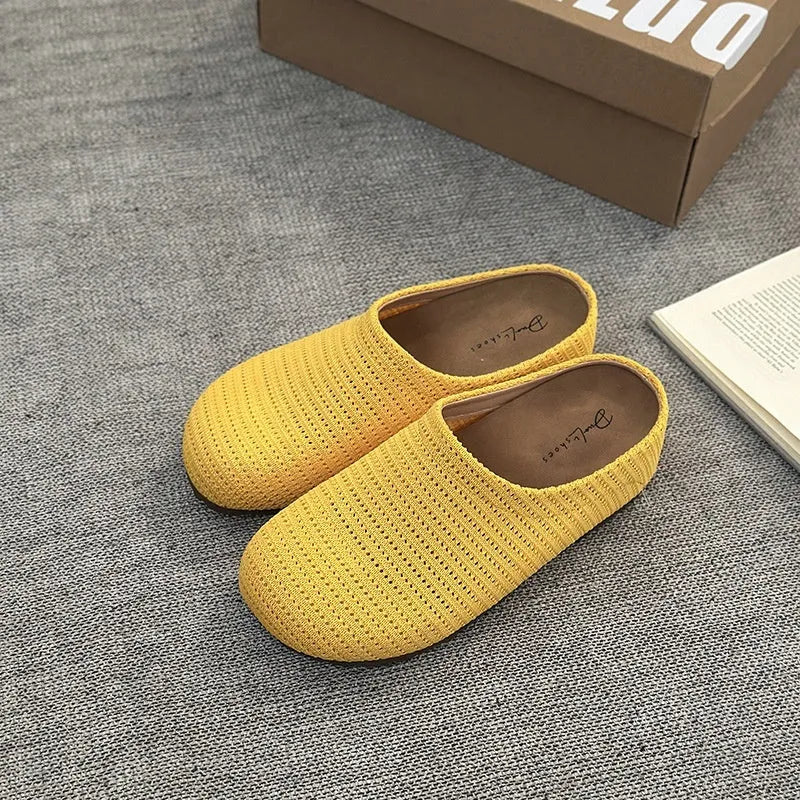 Women's non-slip cloth slippers with rubber sole in beige colour showing round toe design