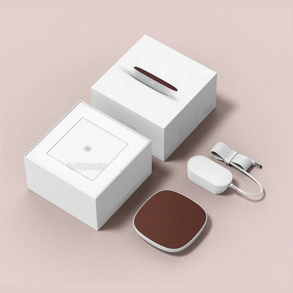 White 12V safety voltage heated base heating coaster on a wooden table