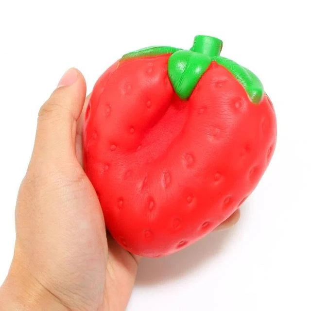 A squishy, strawberry-shaped stress relief ball made of durable polyurethane material