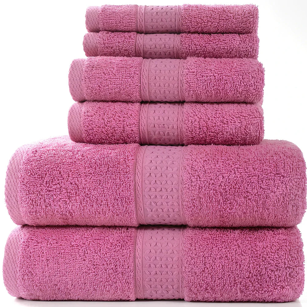 Cotton towel set showing bath towel, hand towel, and face cloth in coordinated sizes