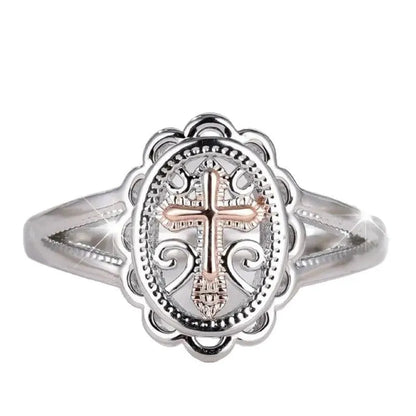 Silver colour women's cross lace ring on finger showing detailed design