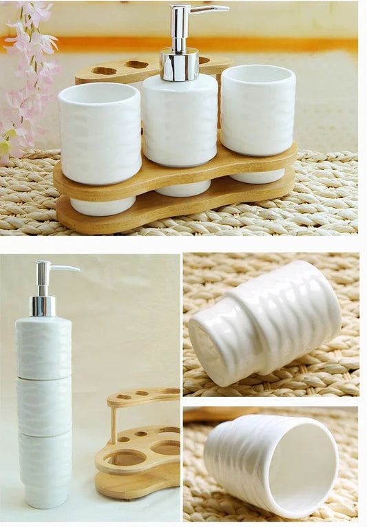 Five-piece bathroom accessories set with ceramic cup and wooden storage frame on bathroom countertop