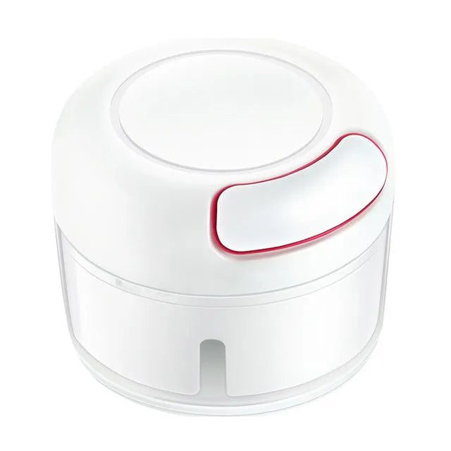 White manual food chopper with stainless steel blades on a kitchen countertop.