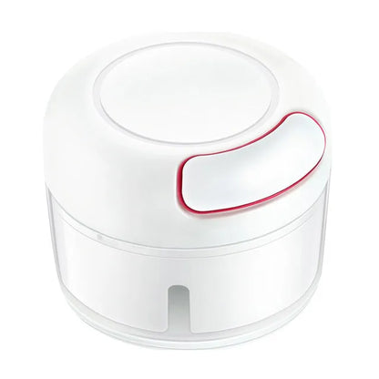 White manual food chopper with stainless steel blades on a kitchen countertop.