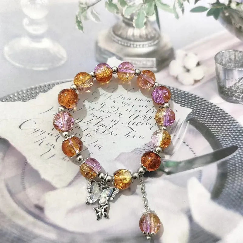 Chinese style glass bead bracelet with bamboo joint design on wrist.