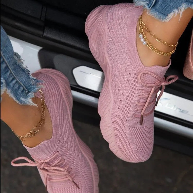 Women's solid colour sneakers with a thick sole, shown in multiple colour options.