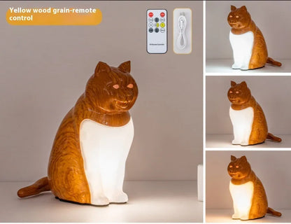 Cat-shaped USB rechargeable table lamp with adjustable colour temperature on wooden desk