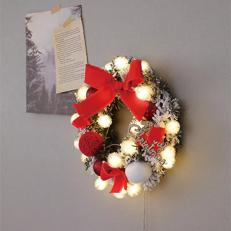 Multicolor Christmas LED light wreath with red berries, pine cones, and holly leaves