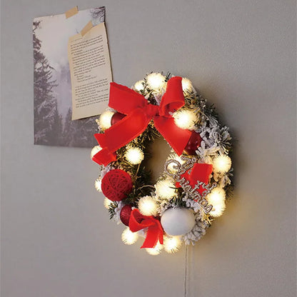 Multicolor Christmas LED light wreath with red berries, pine cones, and holly leaves