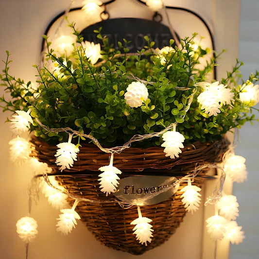 LED pine cone decorative light string with warm white illumination and battery operation
