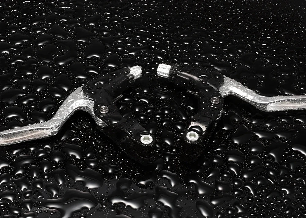 Aluminium bicycle brake lever showing reach adjustment mechanism in black finish