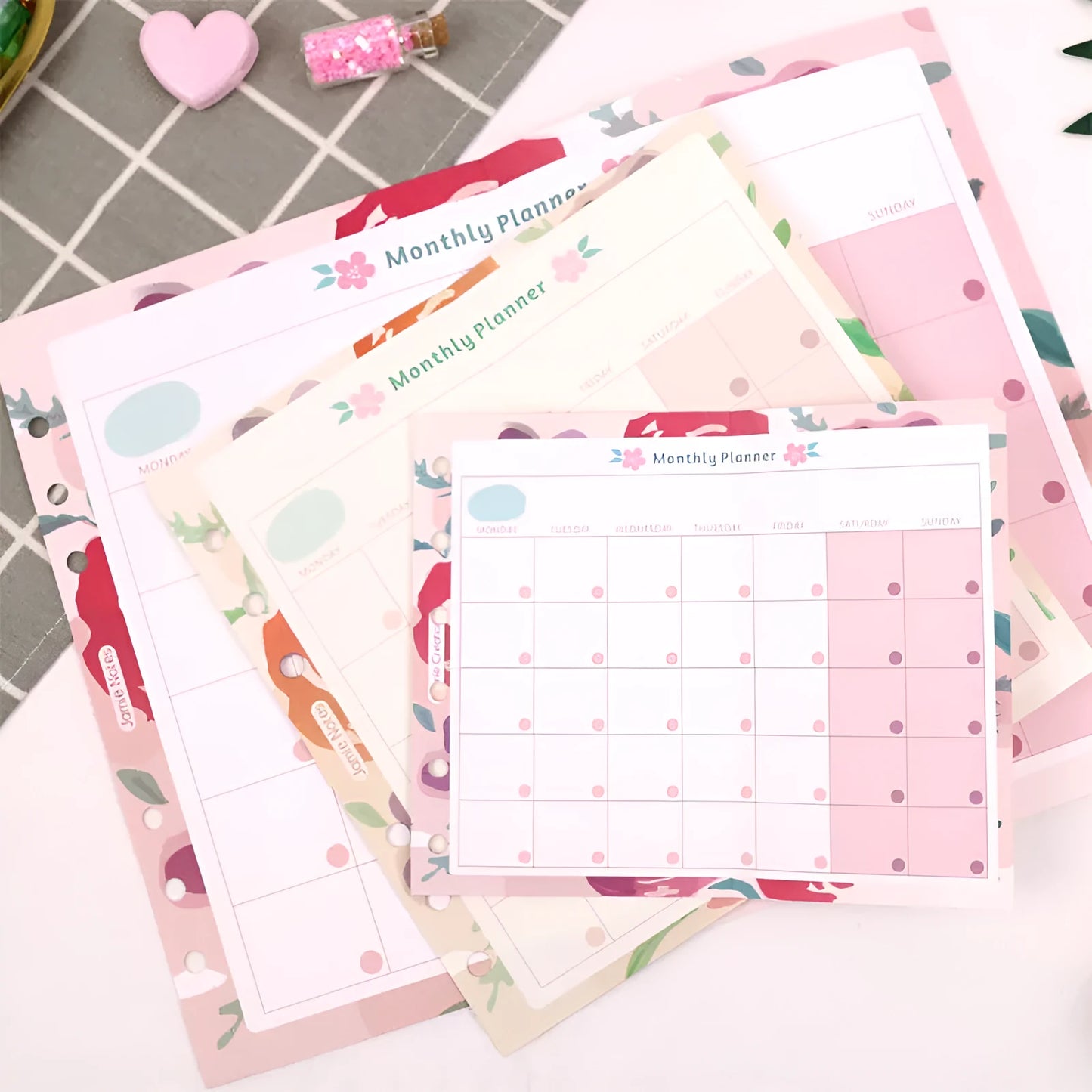 Four options of handbook loose-leaf refills showing floral and symphony designs in A5, A6, and A7 sizes