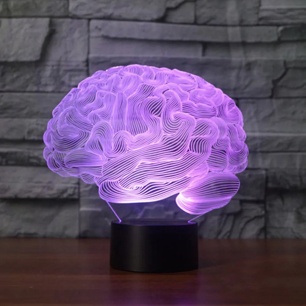 Brain-shaped 3D acrylic LED desk lamp on ABS base with remote control, showing colourful light projection.
