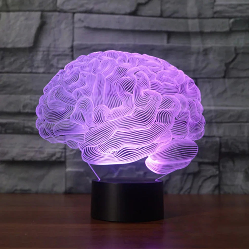 3D brain-shaped LED lamp with colour changing modes and remote control on wooden surface