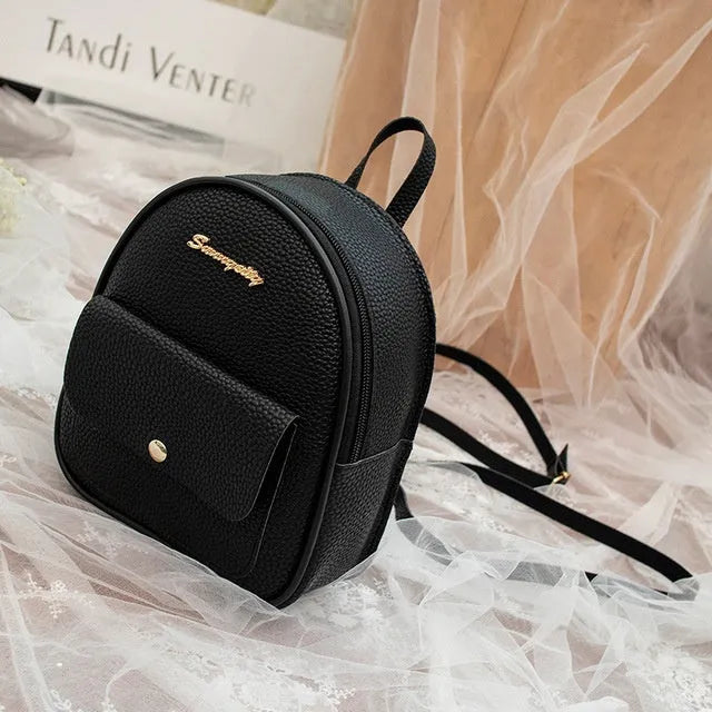 Small women's shoulder backpack in solid colour with zipper closure, dimensions 18.5cm x 8cm x 21cm