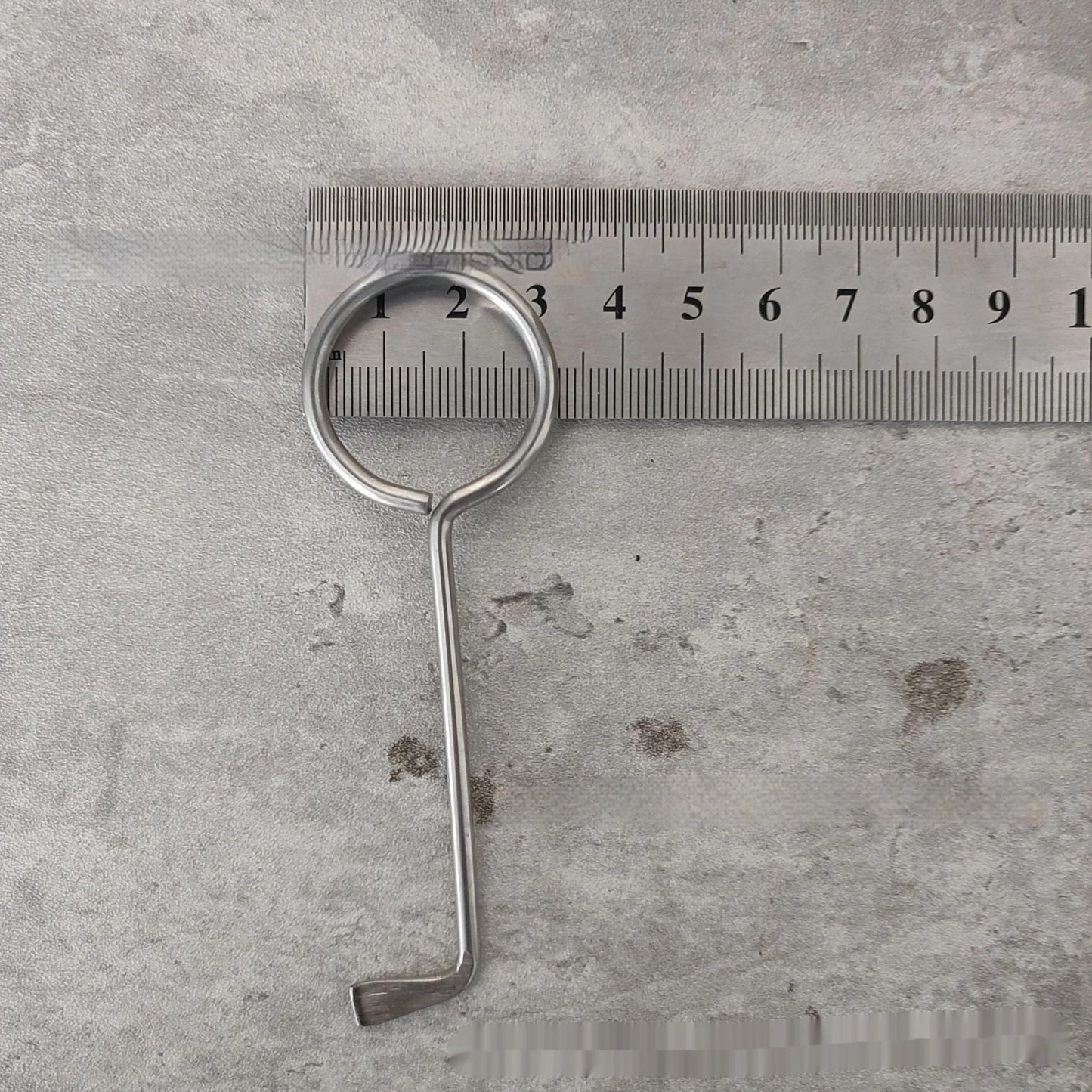 Two silver alloy wrench tools from a portable universal family set on a plain background.