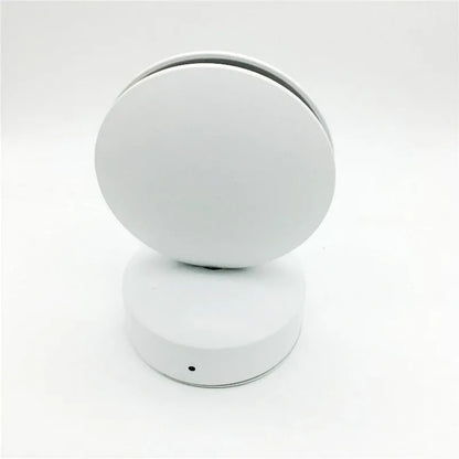 Aluminium and glass LED wall spotlight bar with colour change options, mounted on a corridor wall.