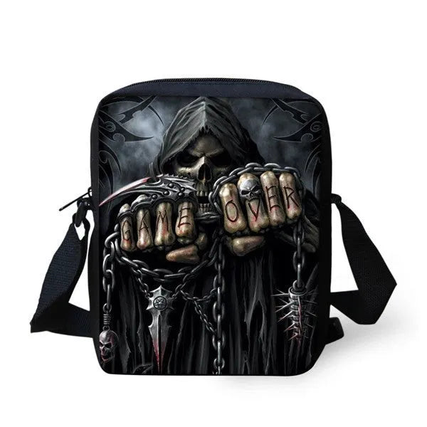 Children's skull print messenger bag with double adjustable straps, shown in a medium size with a zipper pocket.