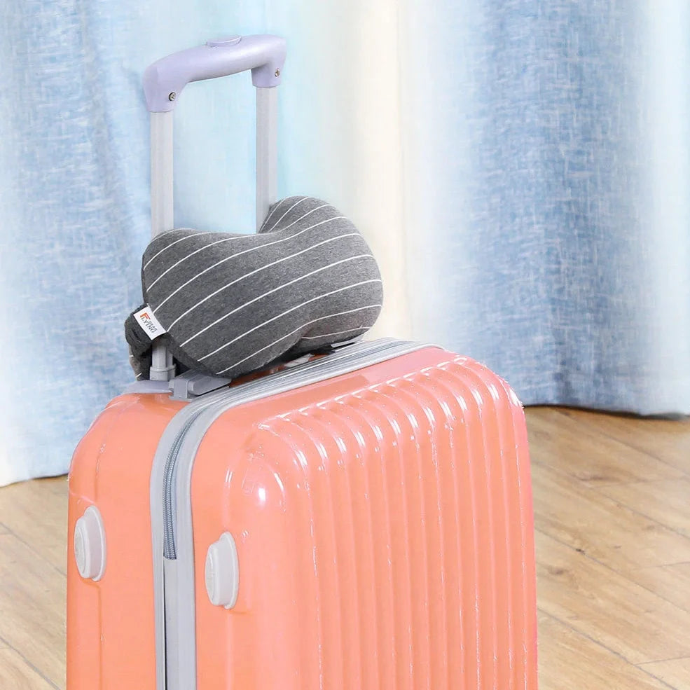 Dark grey two-in-one pillow showing neck support position and eye mask function with 24cm length measurement