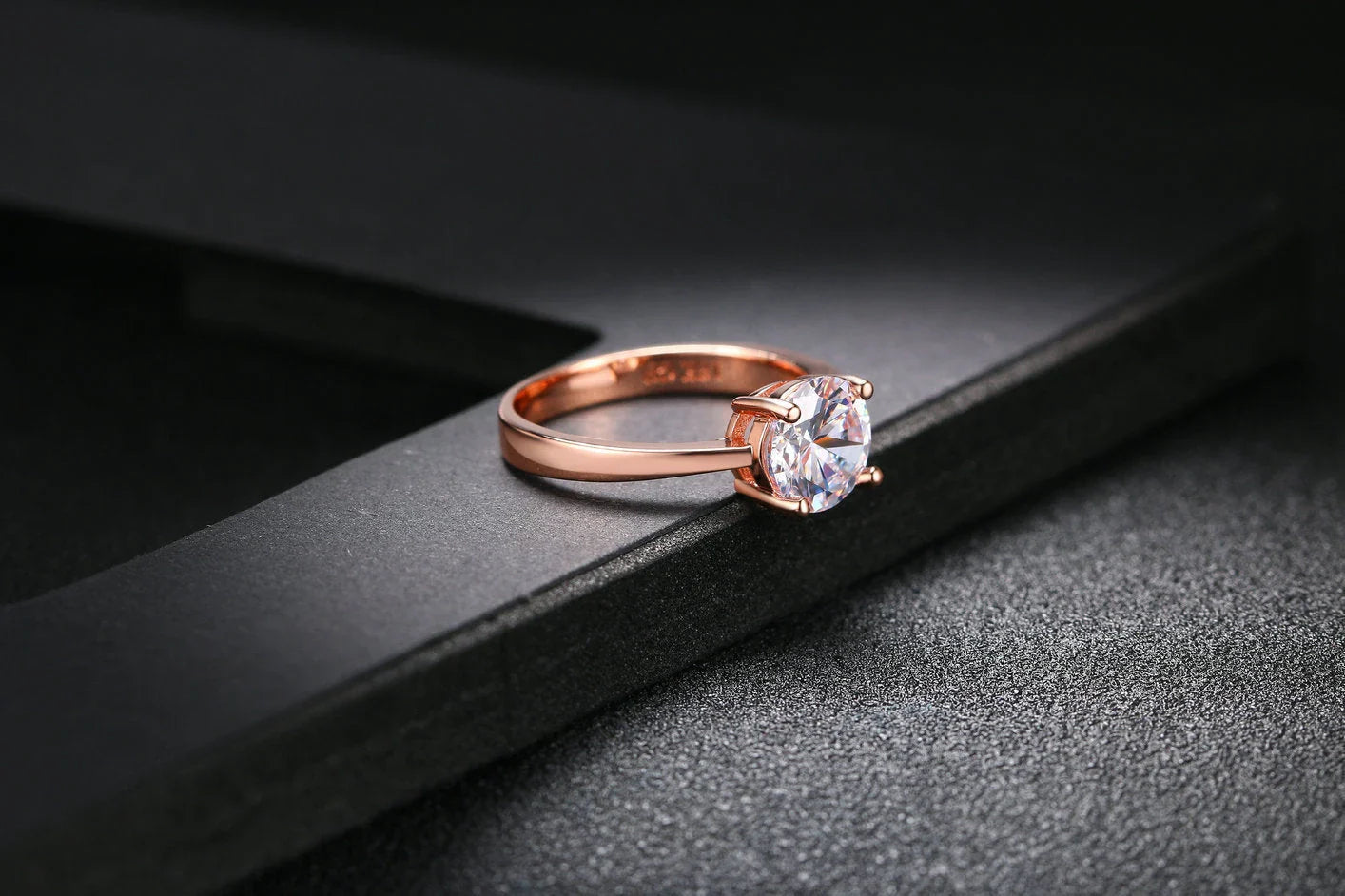 Exquisite rose gold and zircon cocktail ring with intricate geometric design and sparkling zircon gemstones