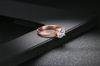 Exquisite rose gold and zircon cocktail ring with intricate geometric design and sparkling zircon gemstones