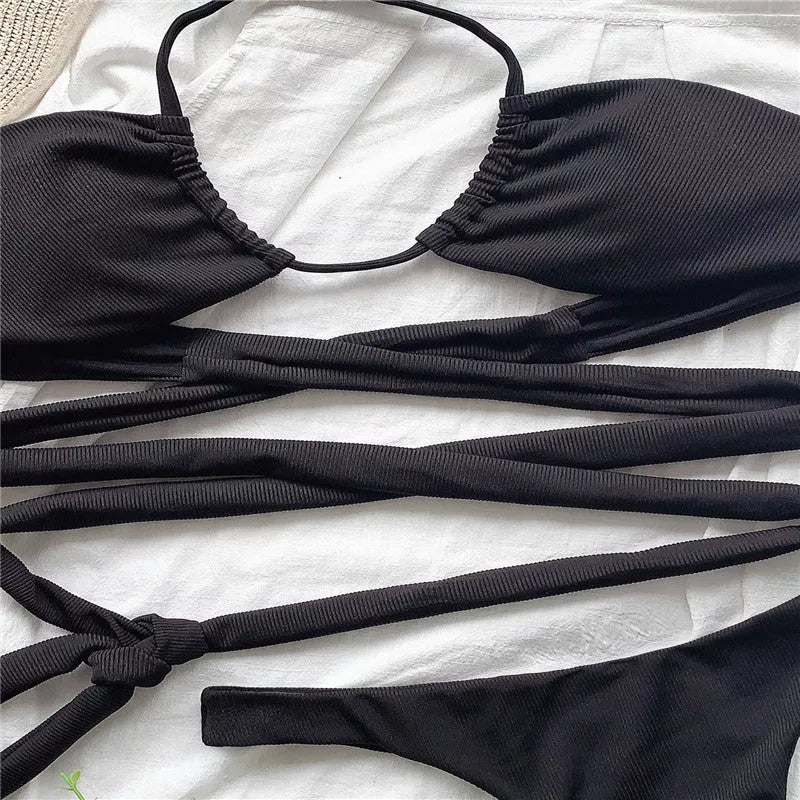 Strappy solid color bikini for women in black, featuring quick-drying polyester fabric.