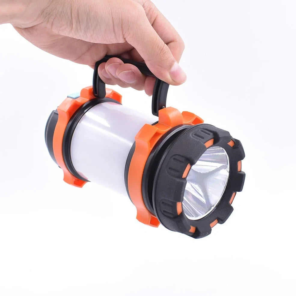 Green camping light with LED display showing multiple lighting modes and USB charging port