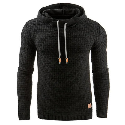 Man wearing a cotton-polyester blend hooded sweatshirt in grey, showing the front design and hood.