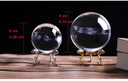 Solar system crystal ball showing planets inside K9 optical crystal sphere on metallic base
