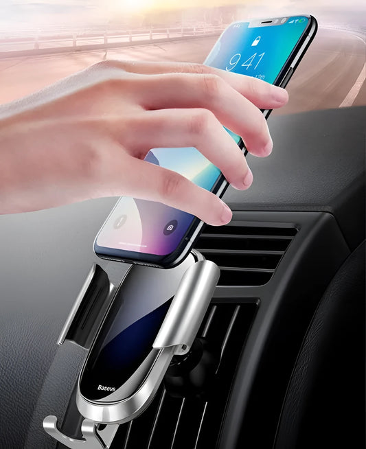 Universal car phone holder with adjustable swivel joint mounted on car windscreen holding smartphone