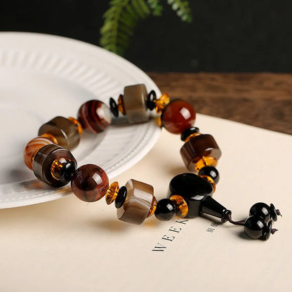 Natural agate ethnic bracelet with geometric design featuring multiple agate bead types and sizes